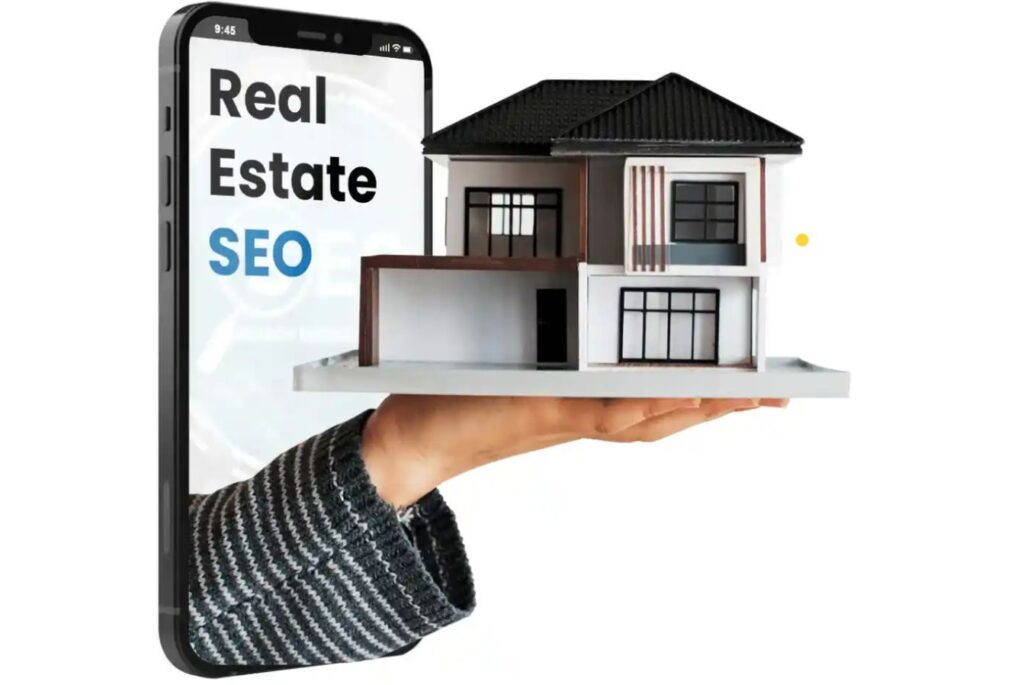 Real estate SEO company image showing a mobile phone with ‘Real Estate SEO’ text and a modern house model placed on a hand, representing digital marketing for real estate businesses.”